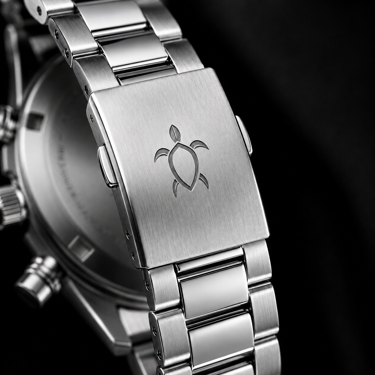 Brushed stainless steel clasp with TURTLE engraving